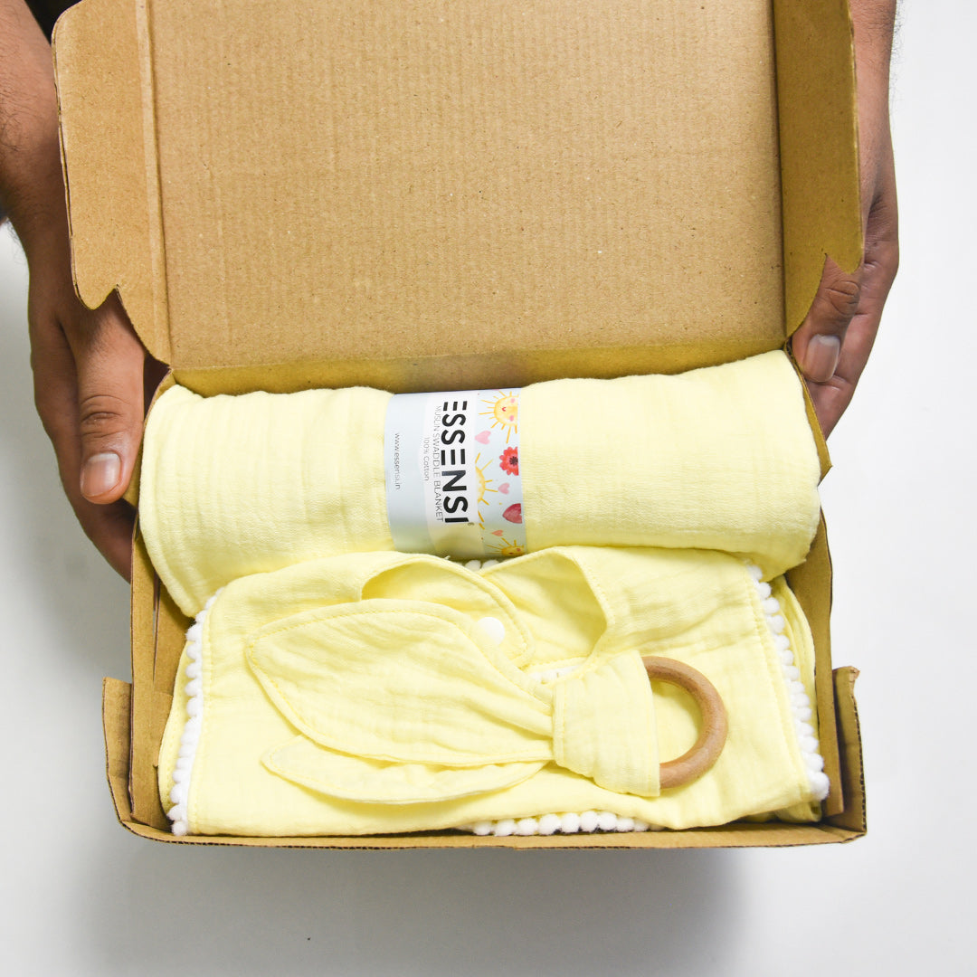 Newborn Baby Gift Hamper | 100% Muslin Cotton Essentials Set with Swaddle, Bibs, Burp Cloth & Teether | Baby Shower Gift Basket for Boys & Girls (Yellow)