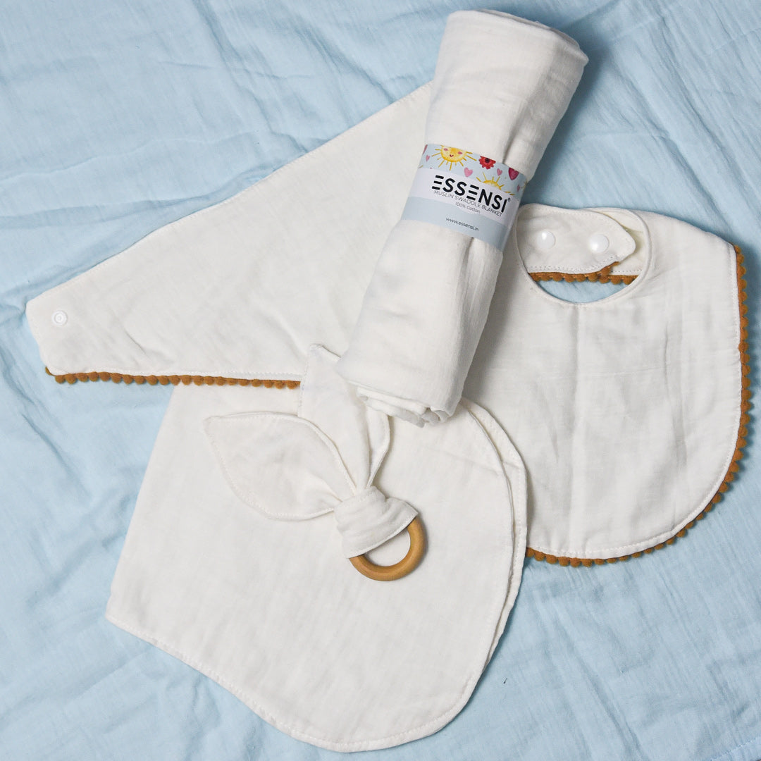 Newborn Baby Gift Hamper | 100% Muslin Cotton Essentials Set with Swaddle, Bibs, Burp Cloth & Teether | Baby Shower Gift Basket for Boys & Girls (White)