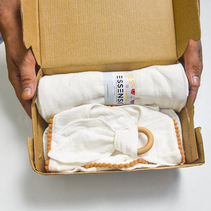 Newborn Baby Gift Hamper | 100% Muslin Cotton Essentials Set with Swaddle, Bibs, Burp Cloth & Teether | Baby Shower Gift Basket for Boys & Girls (White)
