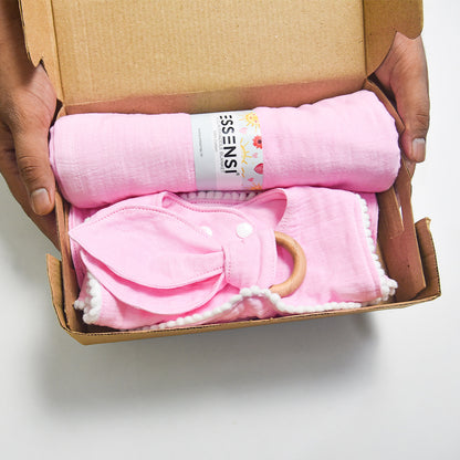 Newborn Baby Gift Hamper | 100% Muslin Cotton Essentials Set with Swaddle, Bibs, Burp Cloth & Teether | Baby Shower Gift Basket for Boys & Girls (Pink)