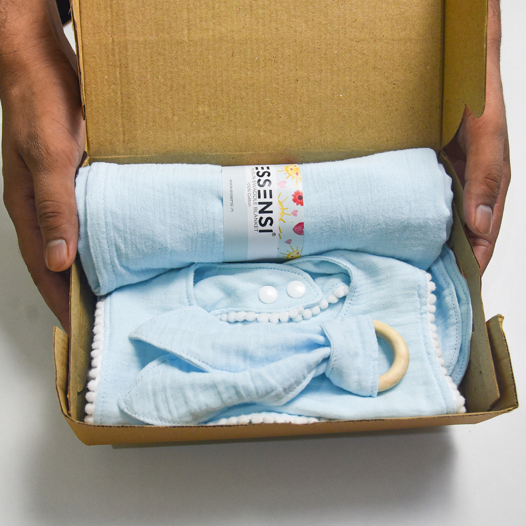 Newborn Baby Gift Hamper | 100% Muslin Cotton Essentials Set with Swaddle, Bibs, Burp Cloth & Teether | Baby Shower Gift Basket for Boys & Girls (Blue)
