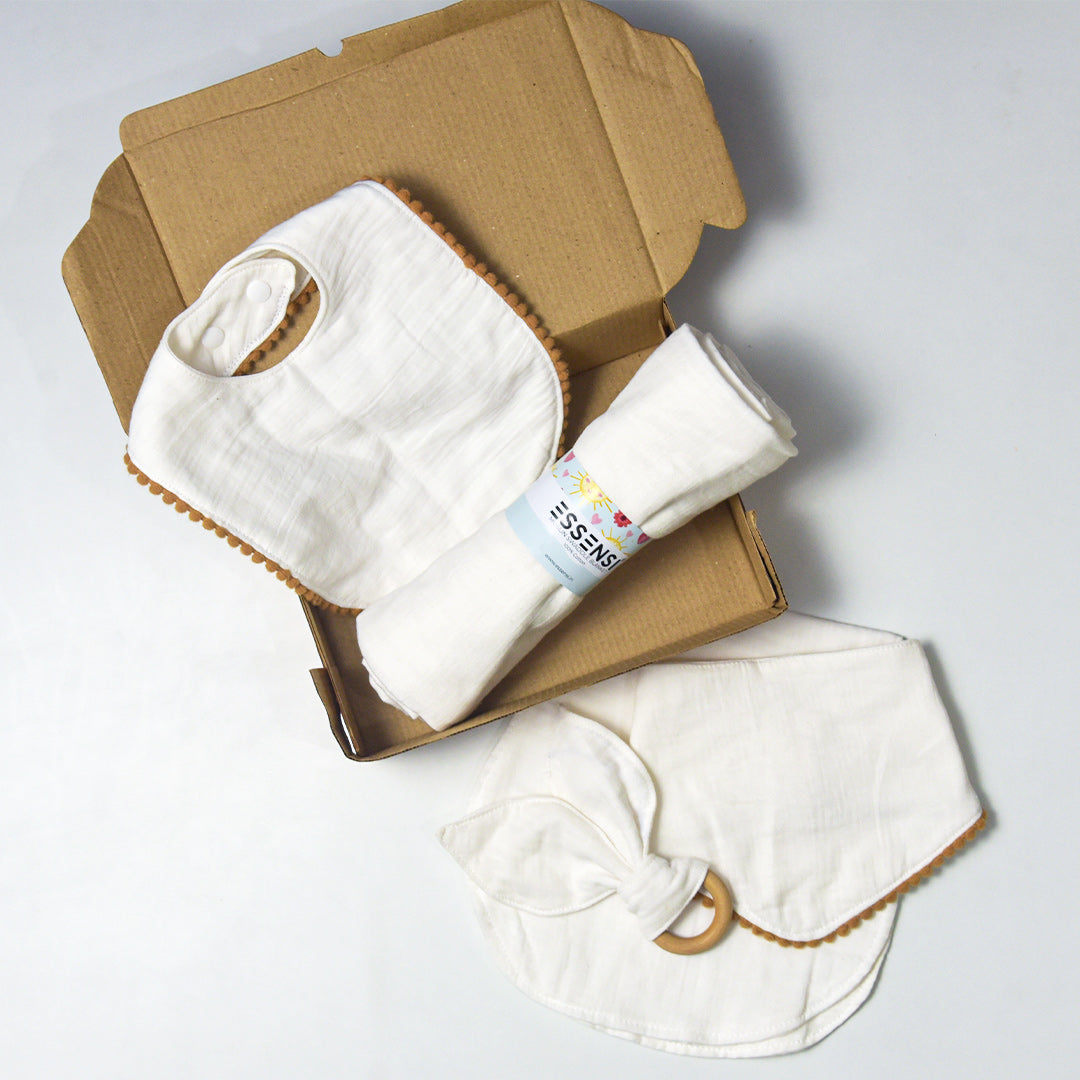 Newborn Baby Gift Hamper | 100% Muslin Cotton Essentials Set with Swaddle, Bibs, Burp Cloth & Teether | Baby Shower Gift Basket for Boys & Girls (White)